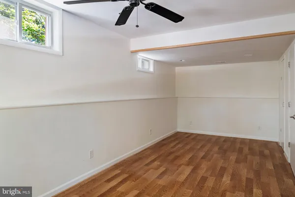 a view of an empty room with windows