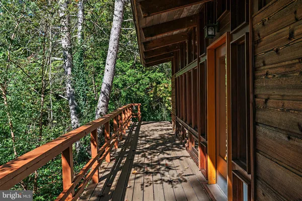 a black and white photo of a swimming pool