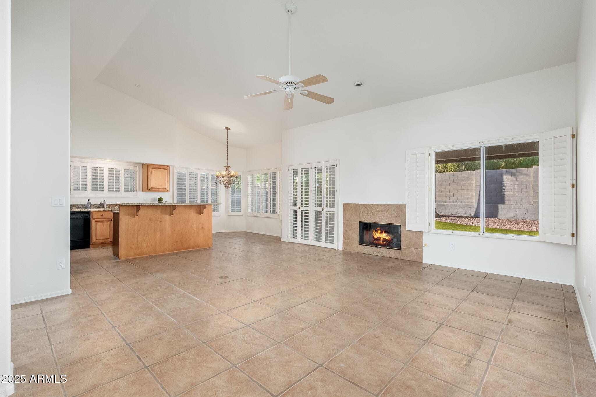 4154 East Rockledge Road Phoenix, AZ 85044 - Photo 10 of 41 a view of a livingroom with a fireplace and window