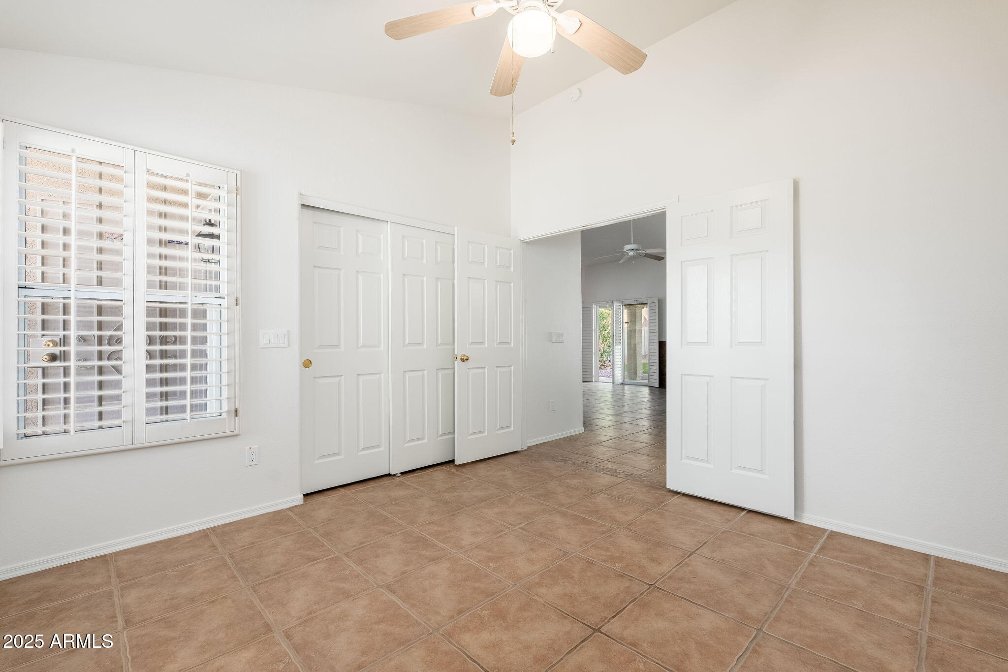 4154 East Rockledge Road Phoenix, AZ 85044 - Photo 22 of 41 a view of an empty room with a window