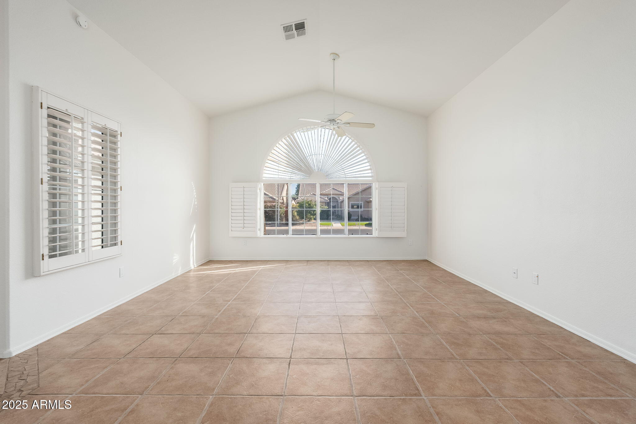 4154 East Rockledge Road Phoenix, AZ 85044 - Photo 25 of 41 a view of an empty room with a window