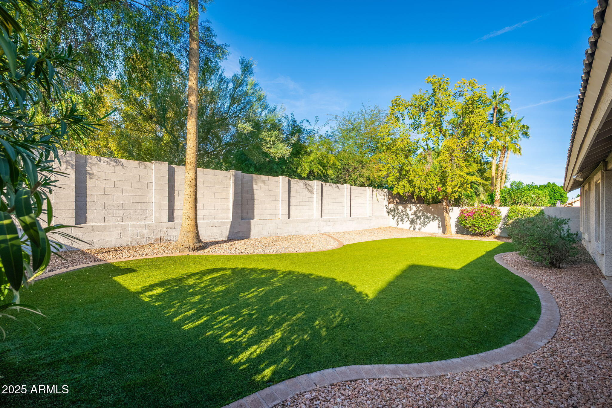 4154 East Rockledge Road Phoenix, AZ 85044 - Photo 36 of 41 a view of a backyard with a small pool