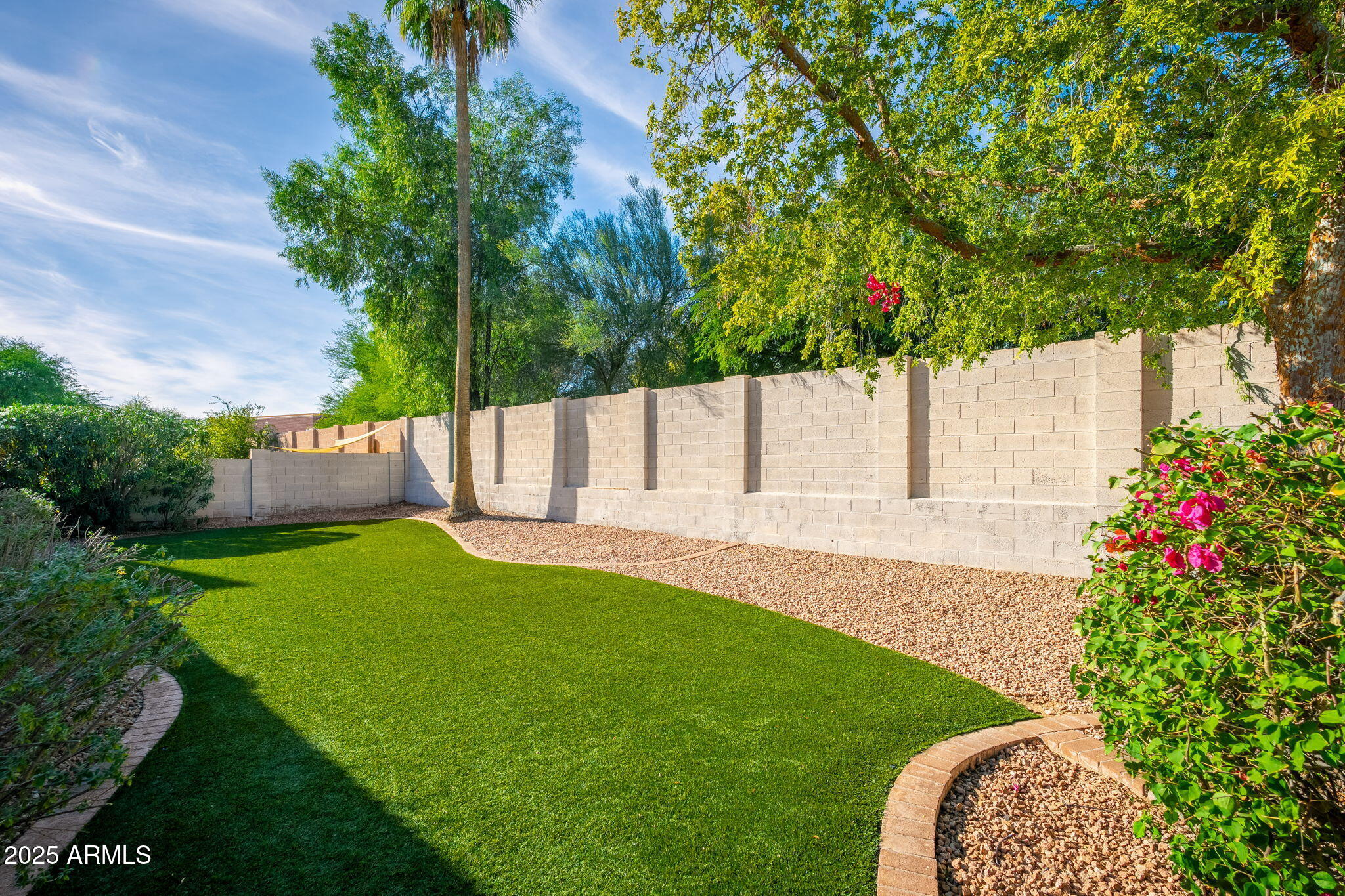 4154 East Rockledge Road Phoenix, AZ 85044 - Photo 38 of 41 a view of yard with small fountain and wooden fence