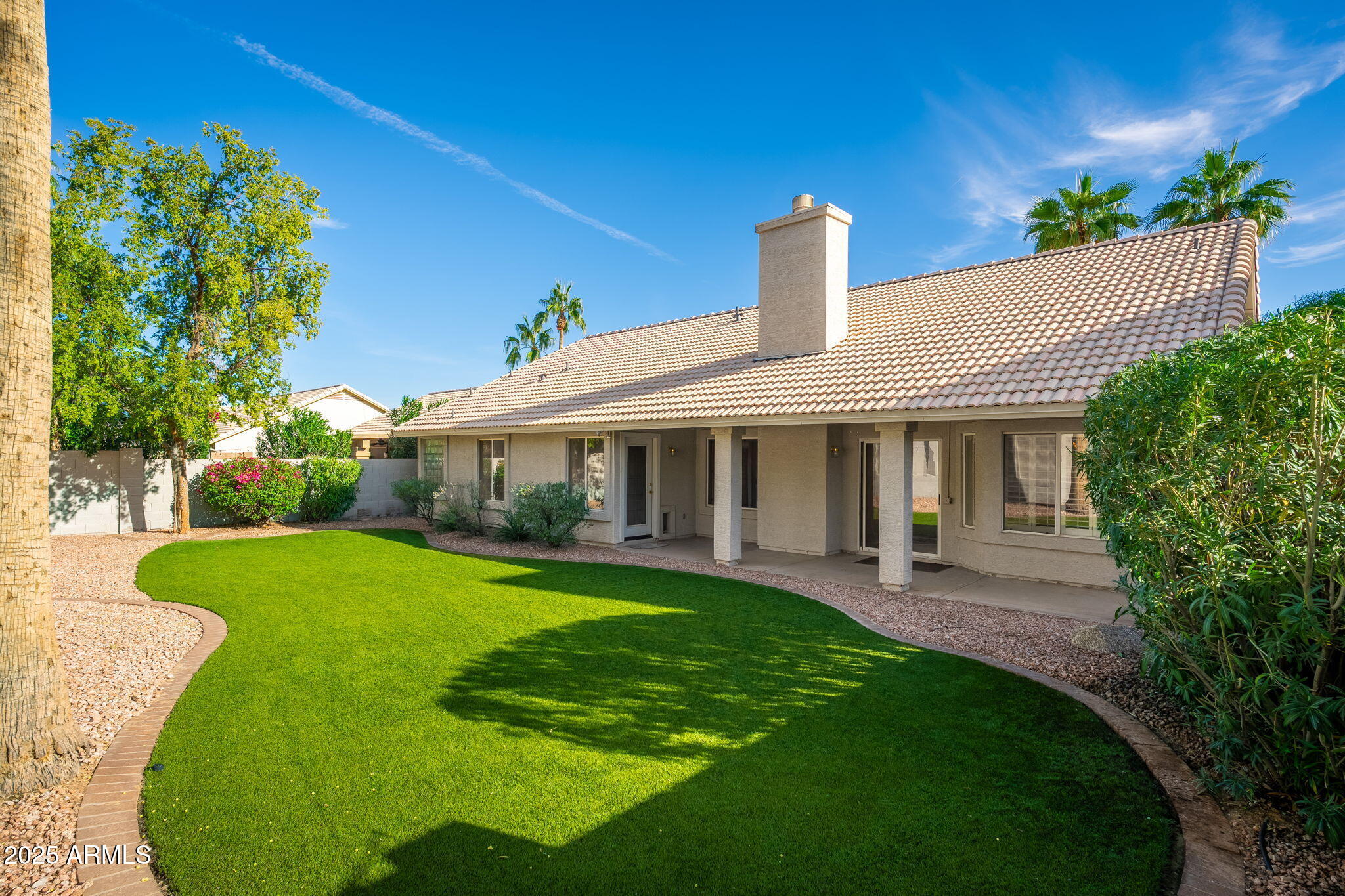 4154 East Rockledge Road Phoenix, AZ 85044 - Photo 4 of 41 a front view of a house with garden