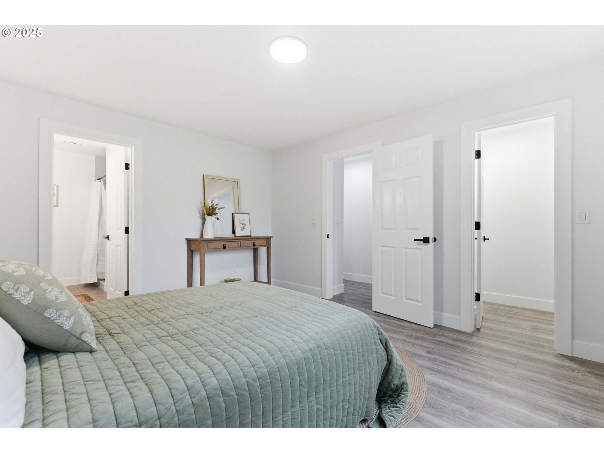 512 Southwest Eastman Parkway Gresham, OR 97080 - Photo 19 of 39 a bedroom with a bed and a painting on the wall