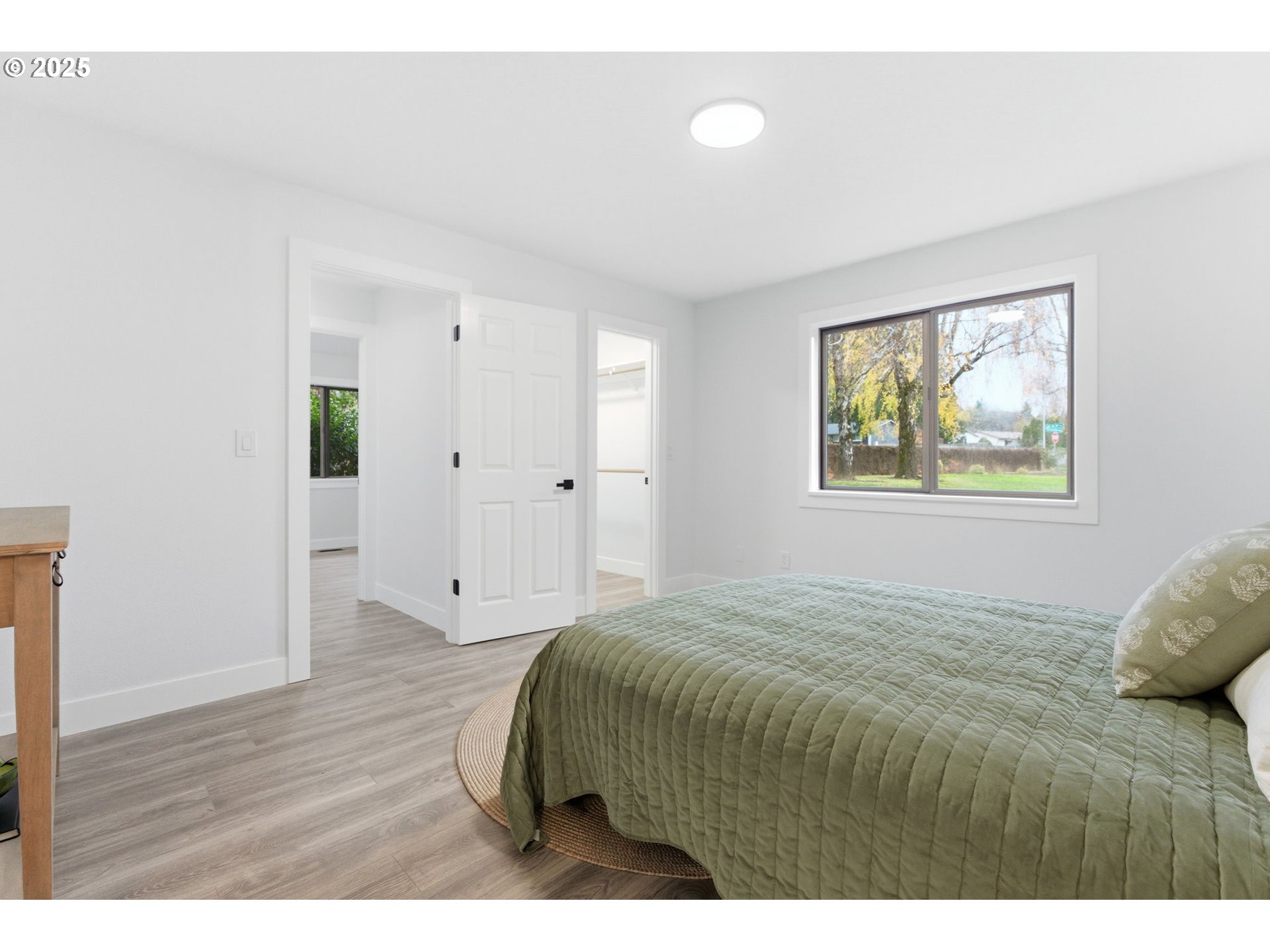 512 Southwest Eastman Parkway Gresham, OR 97080 - Photo 20 of 39 a bedroom with a bed and a painting on the wall