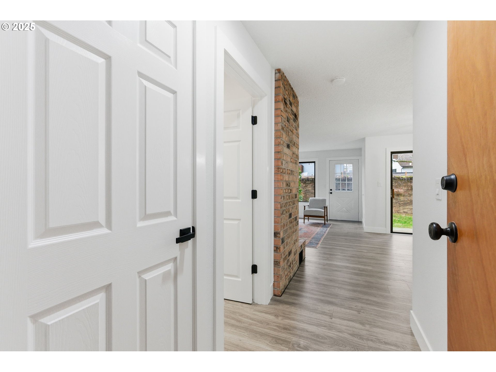 512 Southwest Eastman Parkway Gresham, OR 97080 - Photo 4 of 39 a view of a hallway with wooden floor and closet area