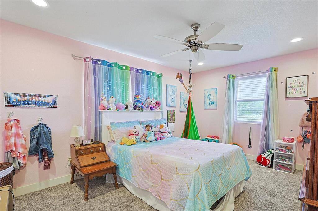 1161 Lynn Creek Road Jacksboro, TX 76458 - Photo 20 of 28 a bed room with a bed mirror and a window
