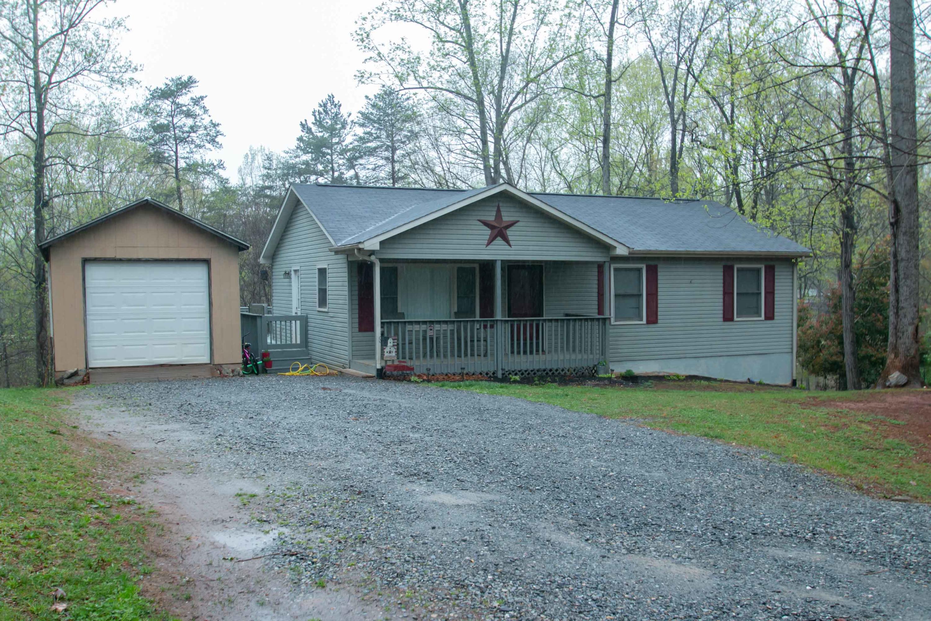 1037 Chandler Road Goodview, VA 24095 - Photo 1 of 21 a house with trees in the background
