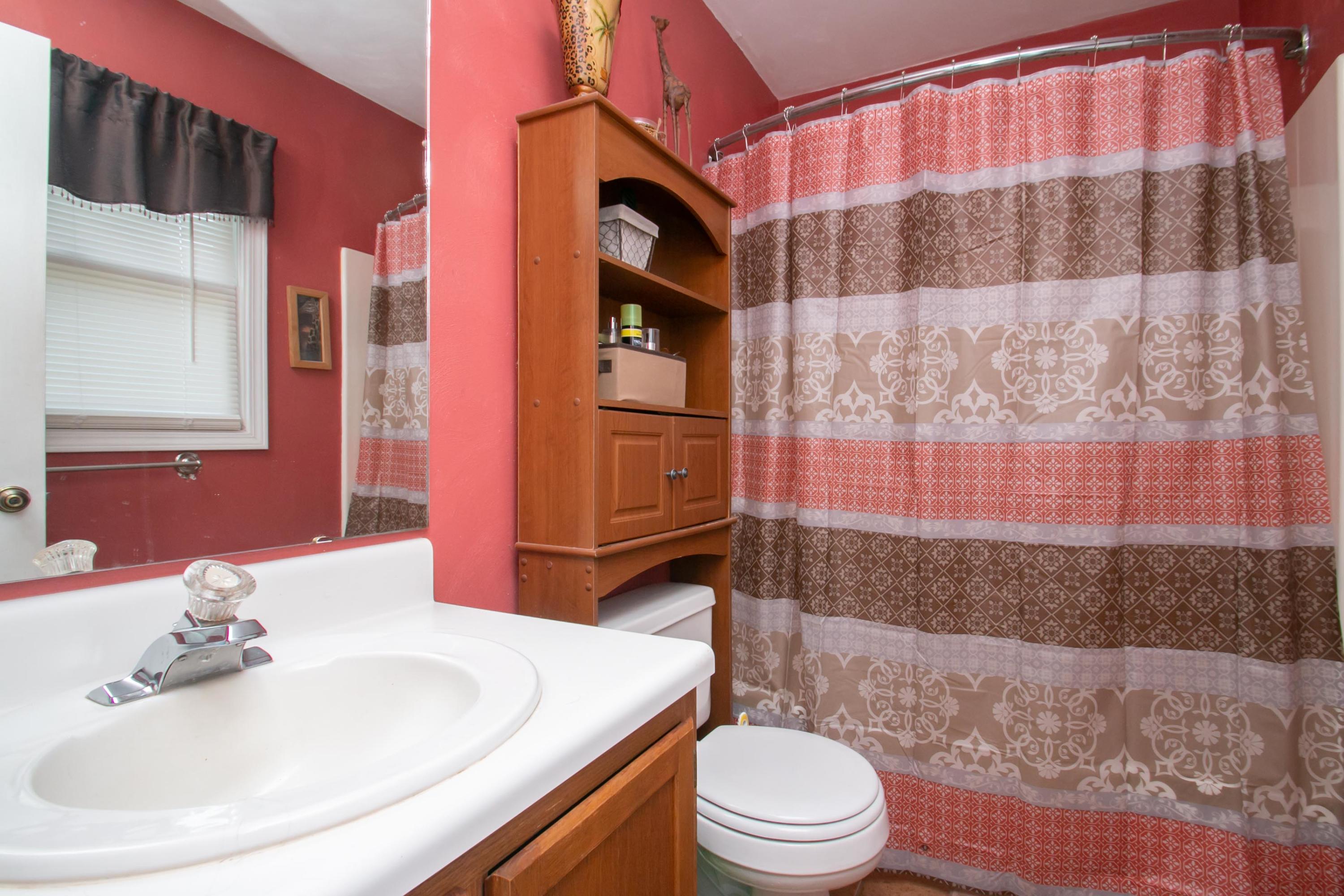 1037 Chandler Road Goodview, VA 24095 - Photo 10 of 21 a bathroom with a sink a toilet and shower
