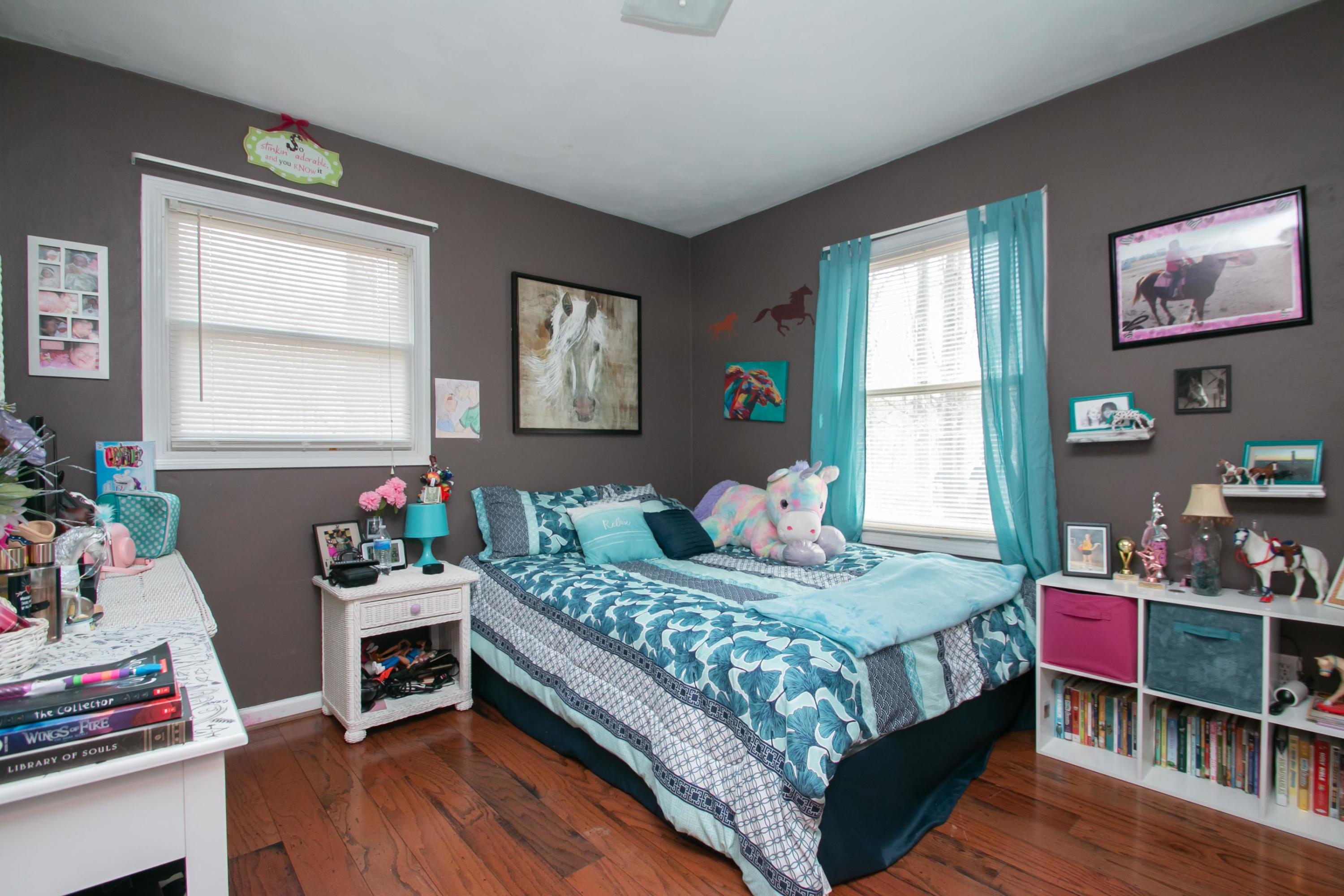 1037 Chandler Road Goodview, VA 24095 - Photo 11 of 21 a bedroom with a bed and a wooden floor