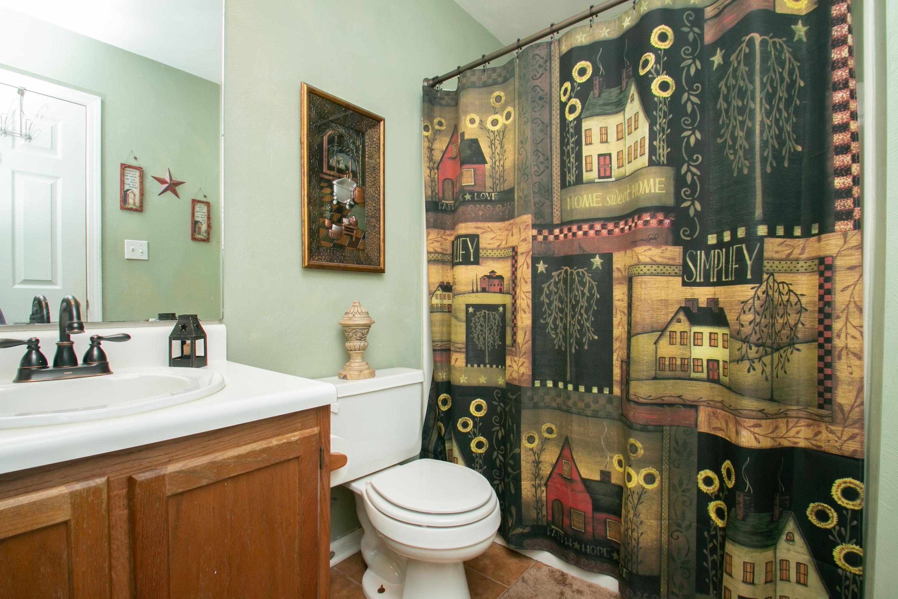 1037 Chandler Road Goodview, VA 24095 - Photo 13 of 21 a bathroom with a toilet sink and mirror
