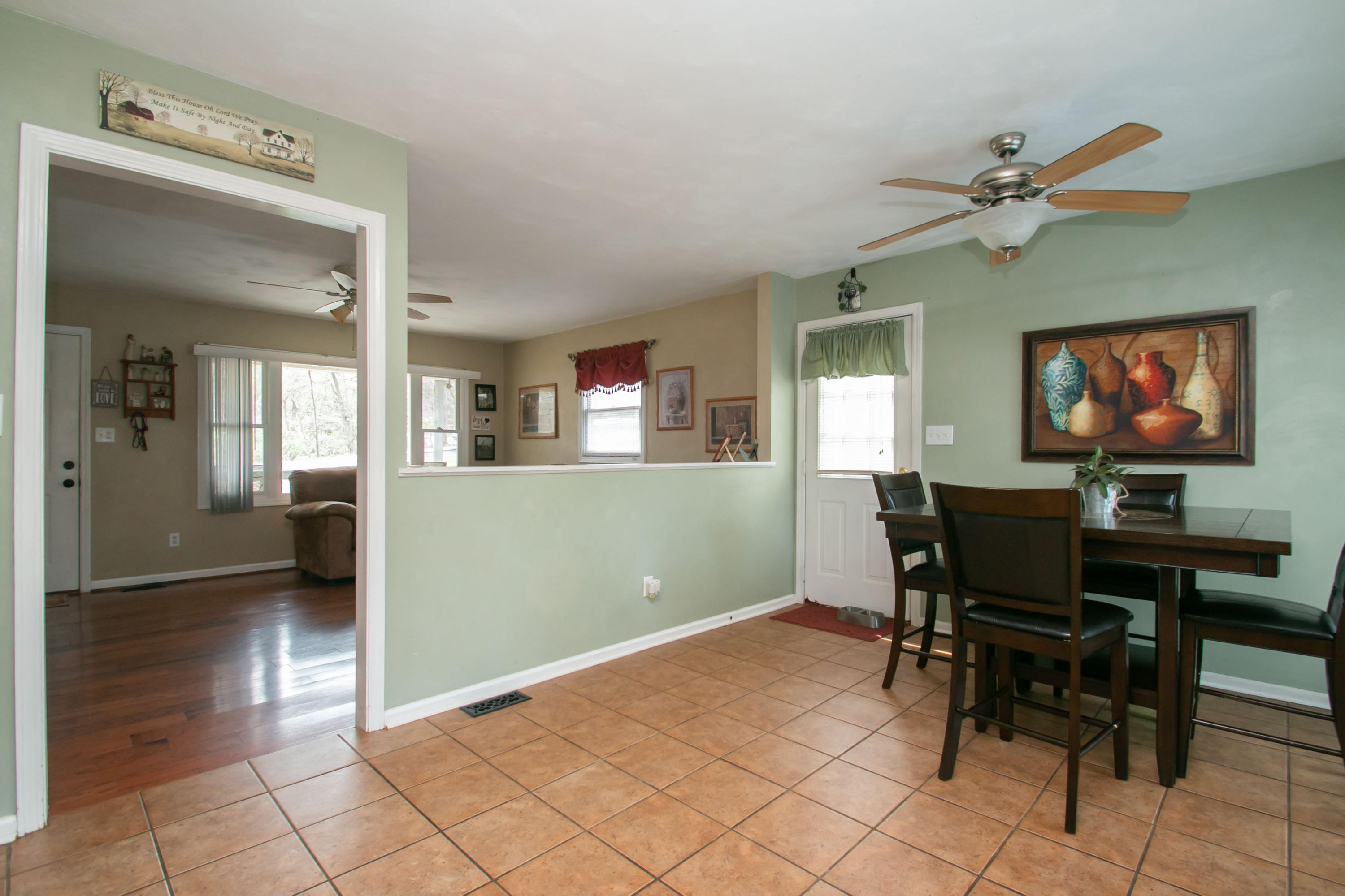 1037 Chandler Road Goodview, VA 24095 - Photo 6 of 21 a view of a livingroom with furniture and a dining table