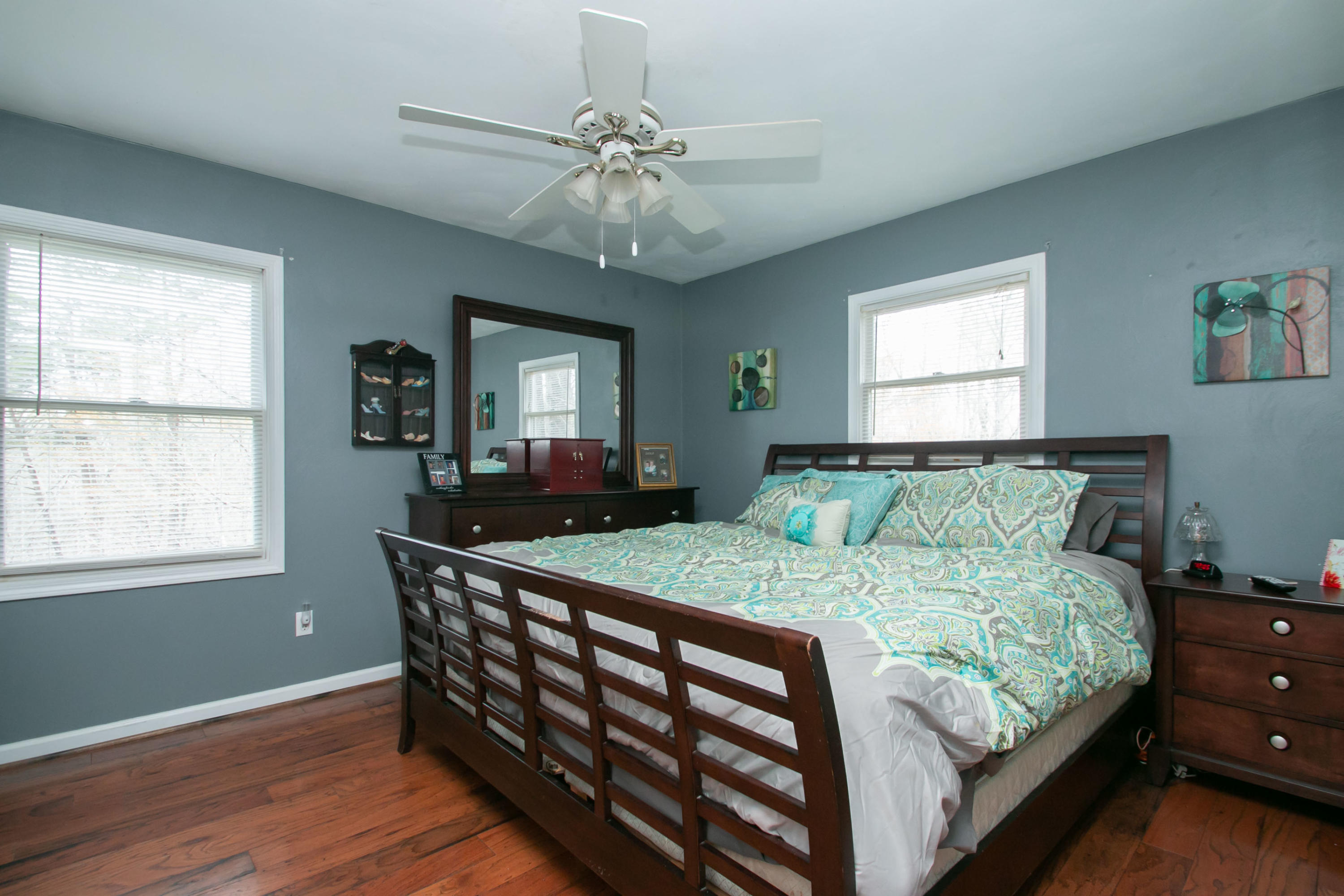 1037 Chandler Road Goodview, VA 24095 - Photo 7 of 21 a bedroom with a bed and a chandelier