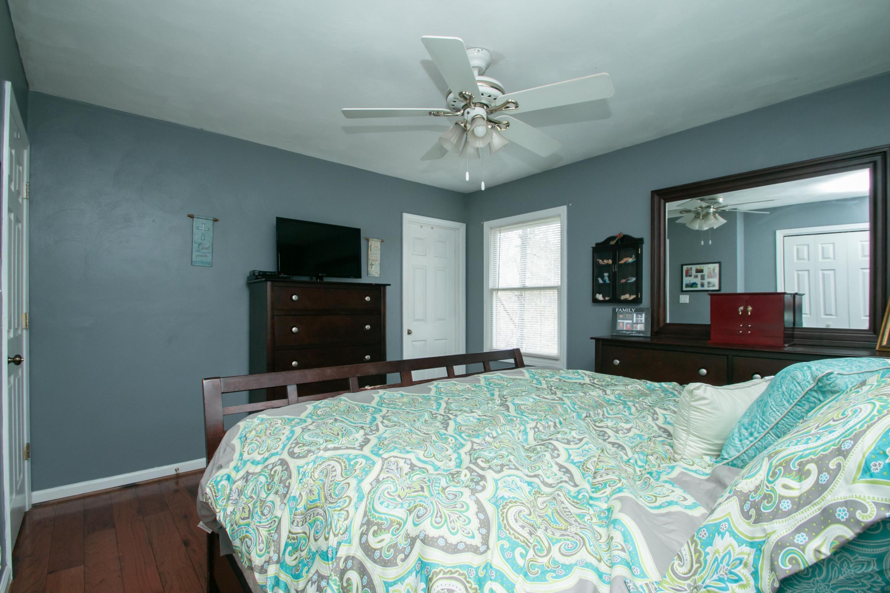1037 Chandler Road Goodview, VA 24095 - Photo 8 of 21 a bedroom with a bed and a flat screen tv