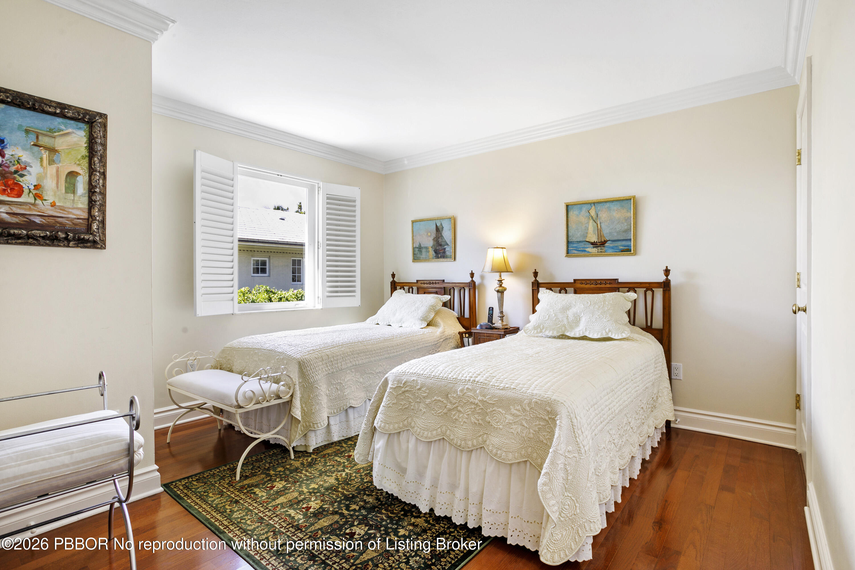 380 Cocoanut Row, Unit 1 Palm Beach, FL 33480 - Photo 16 of 32 a bedroom with two beds and painting on the wall