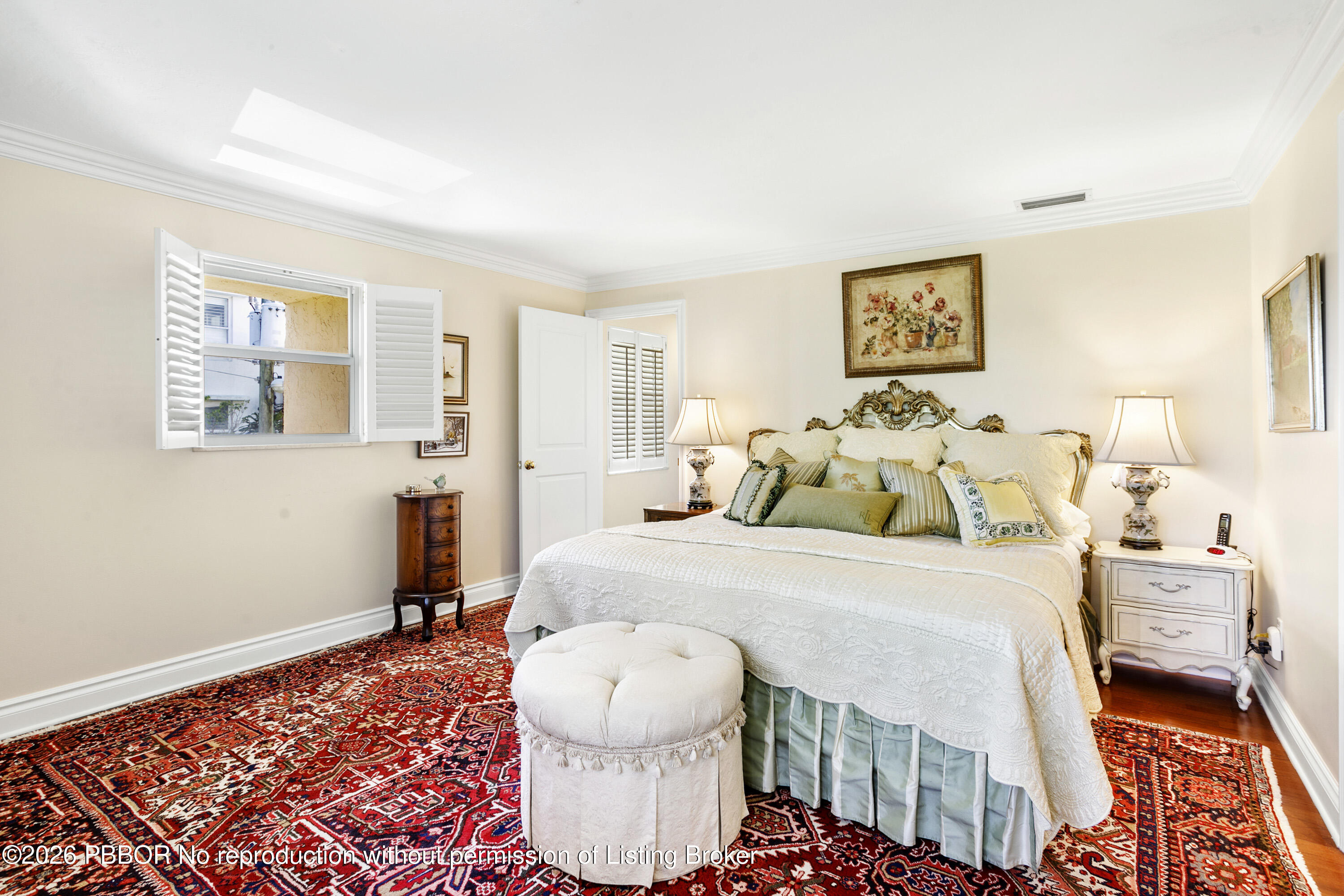 380 Cocoanut Row, Unit 1 Palm Beach, FL 33480 - Photo 18 of 32 a bed room with a bed and a lamp
