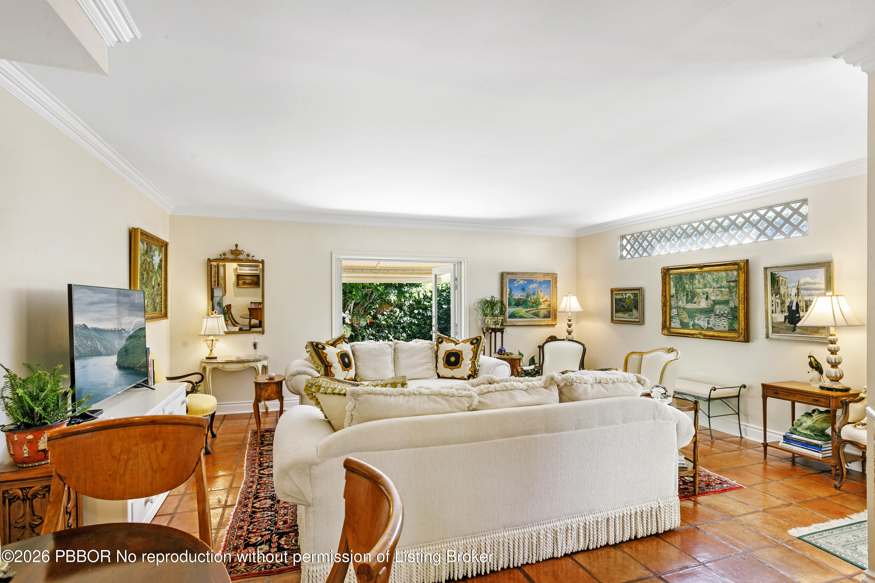 380 Cocoanut Row, Unit 1 Palm Beach, FL 33480 - Photo 3 of 32 a living room with furniture a large window and a fireplace