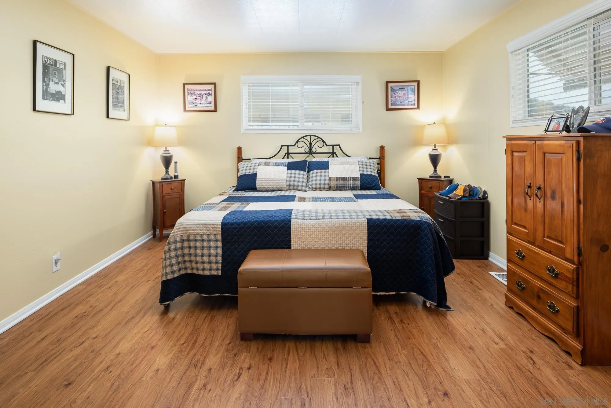 262 Brookside Lane Oceanside, CA 92056 - Photo 14 of 43 a bedroom with a bed and wooden floor