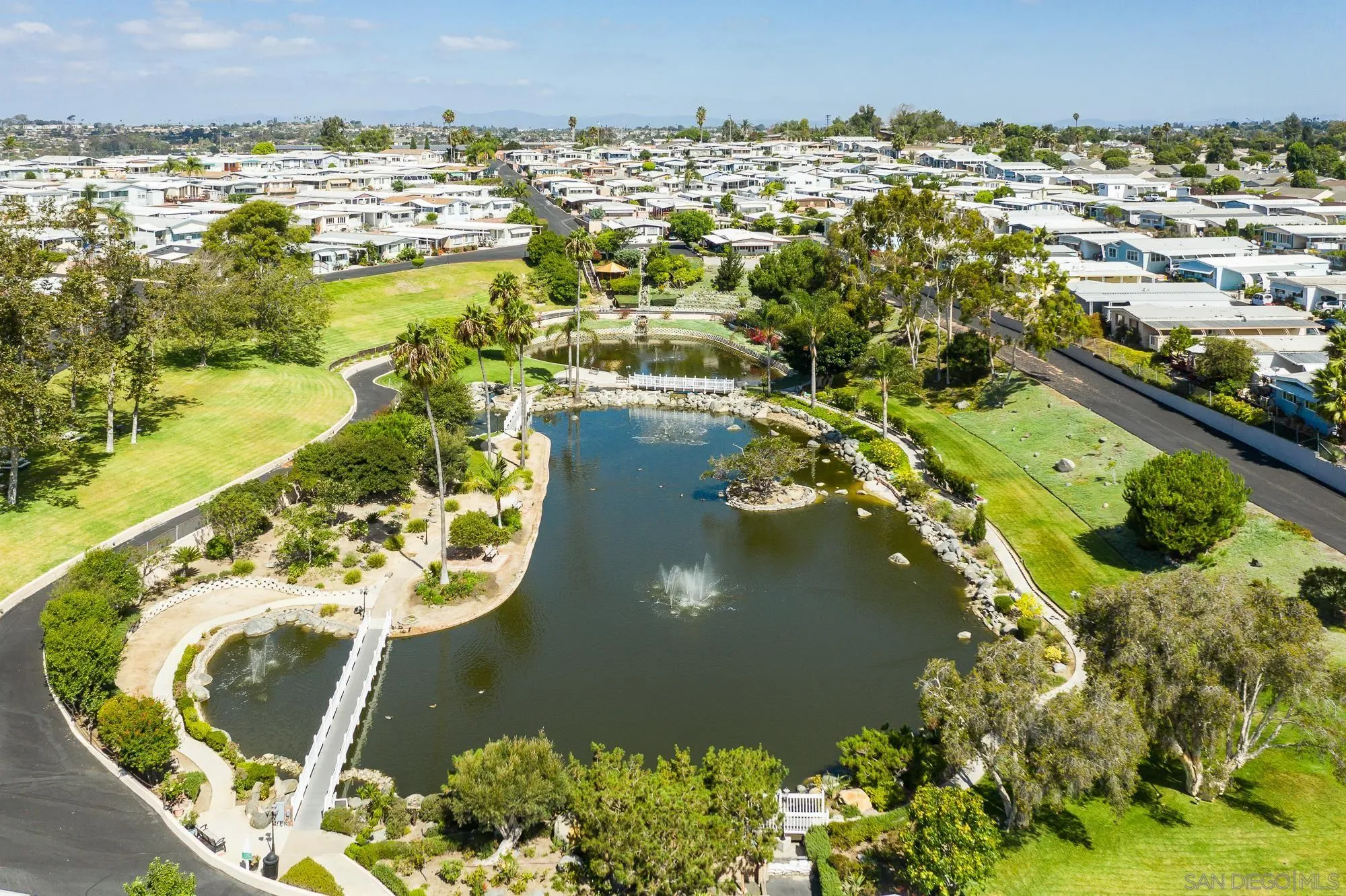 262 Brookside Lane Oceanside, CA 92056 - Photo 30 of 43 an aerial view of a house with a lake view