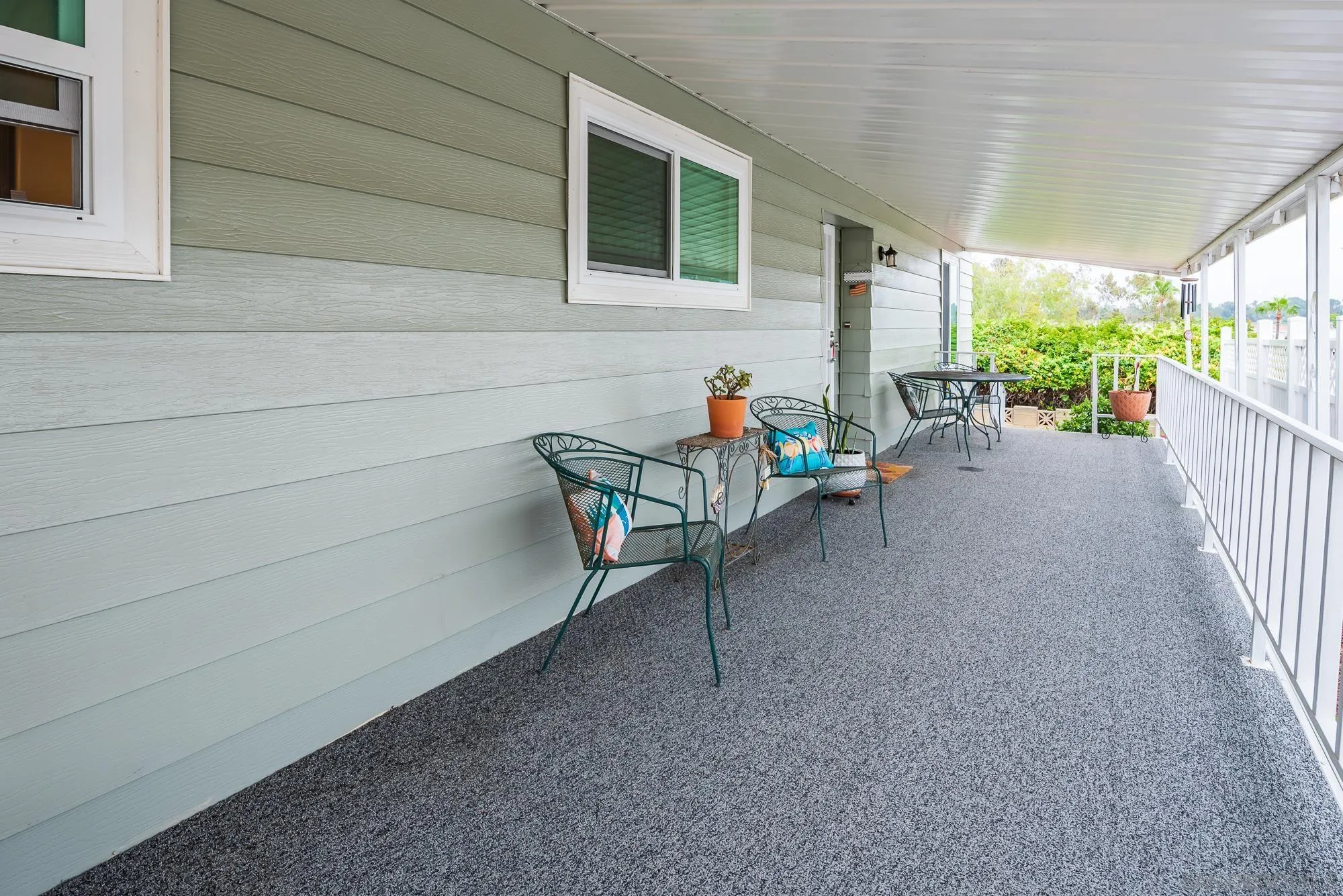 262 Brookside Lane Oceanside, CA 92056 - Photo 3 of 43 a view of a patio with table and chairs and potted plants