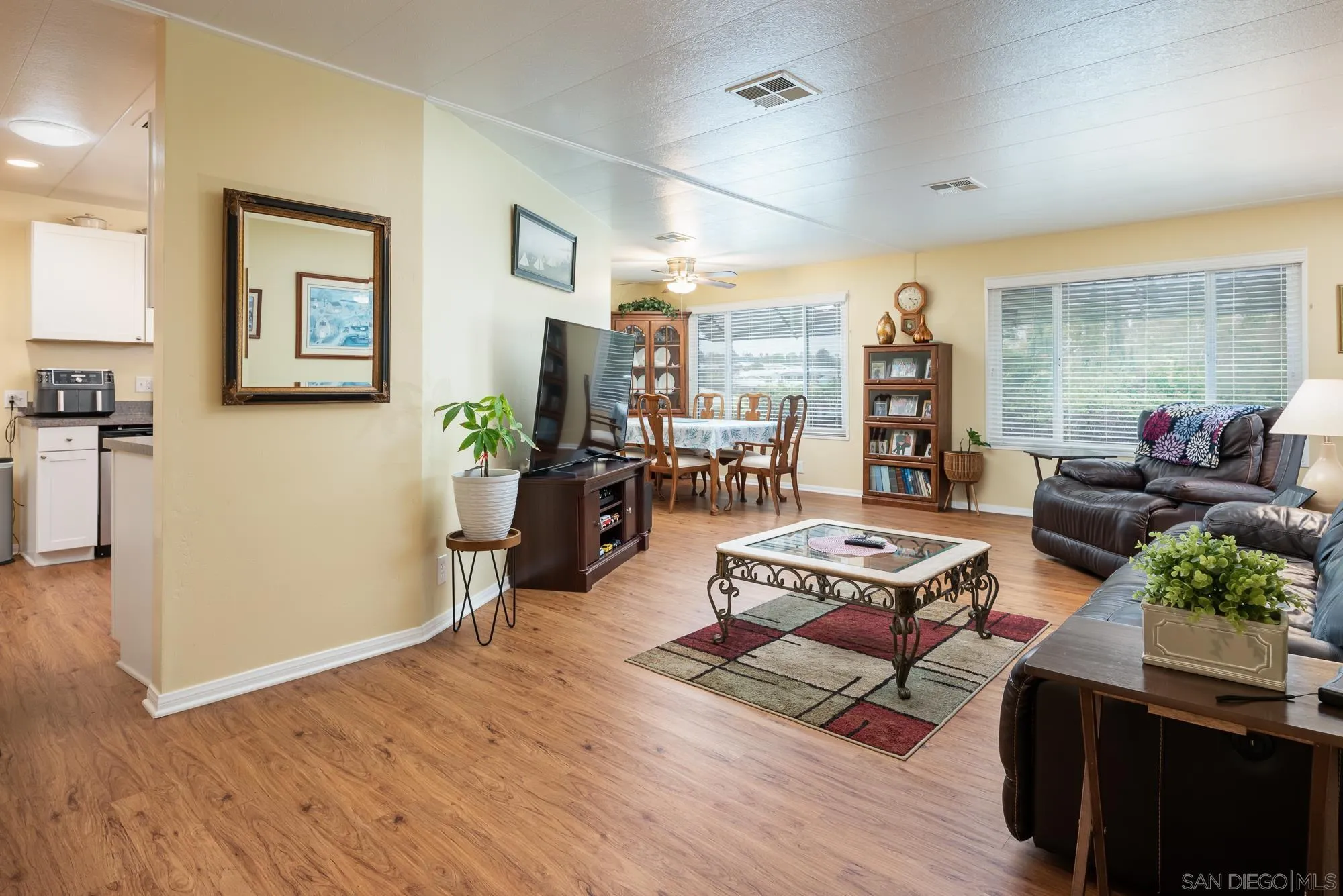 262 Brookside Lane Oceanside, CA 92056 - Photo 6 of 43 a living room with furniture and a wooden floor