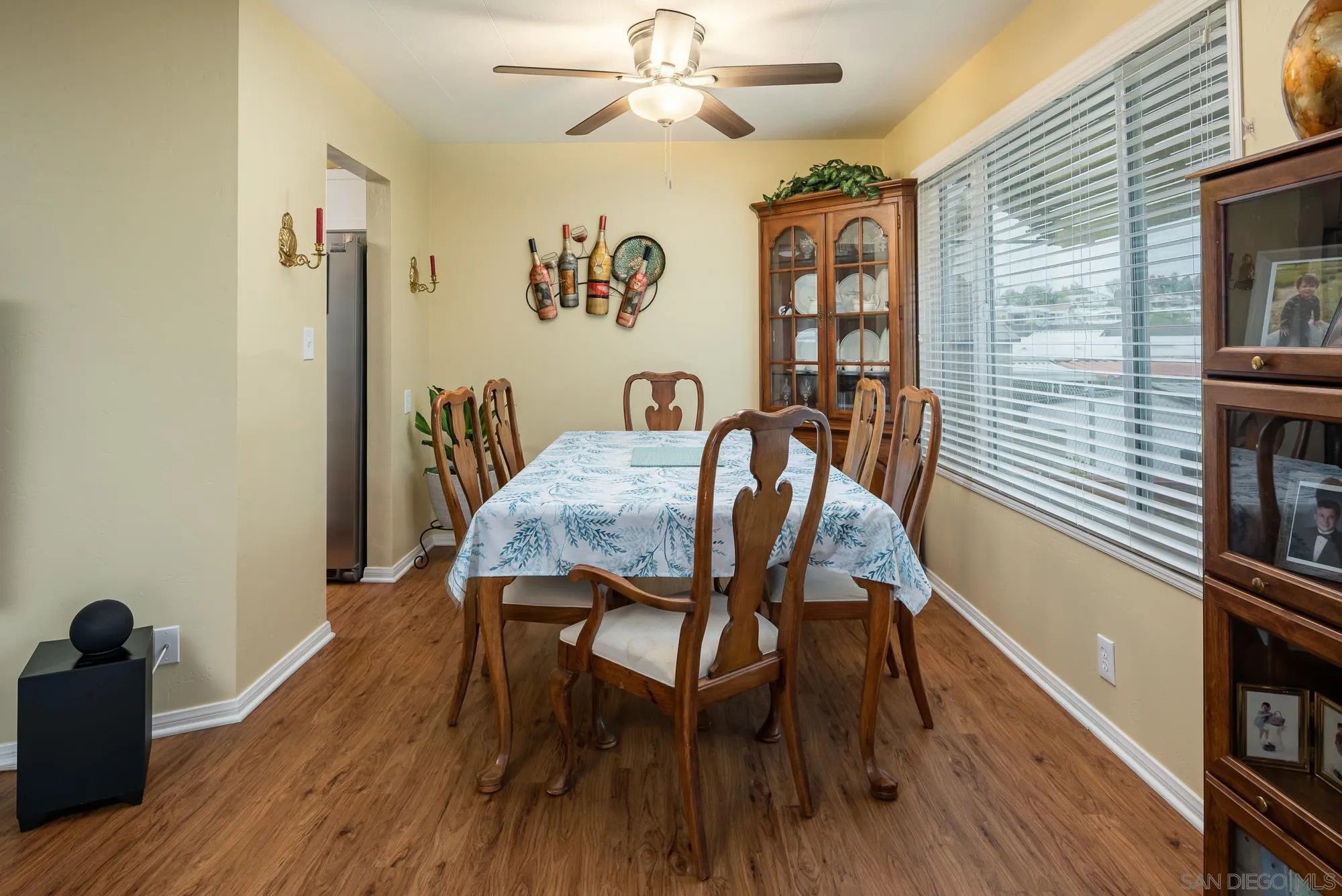262 Brookside Lane Oceanside, CA 92056 - Photo 8 of 43 a view of a dining room with furniture and wooden floor