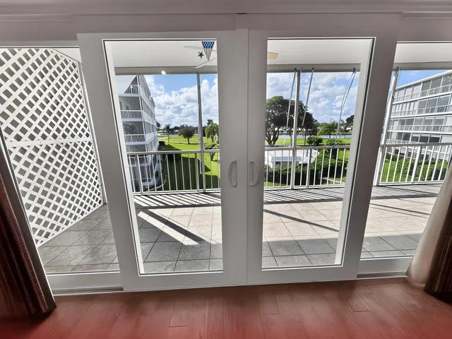a view of front door with wooden floor