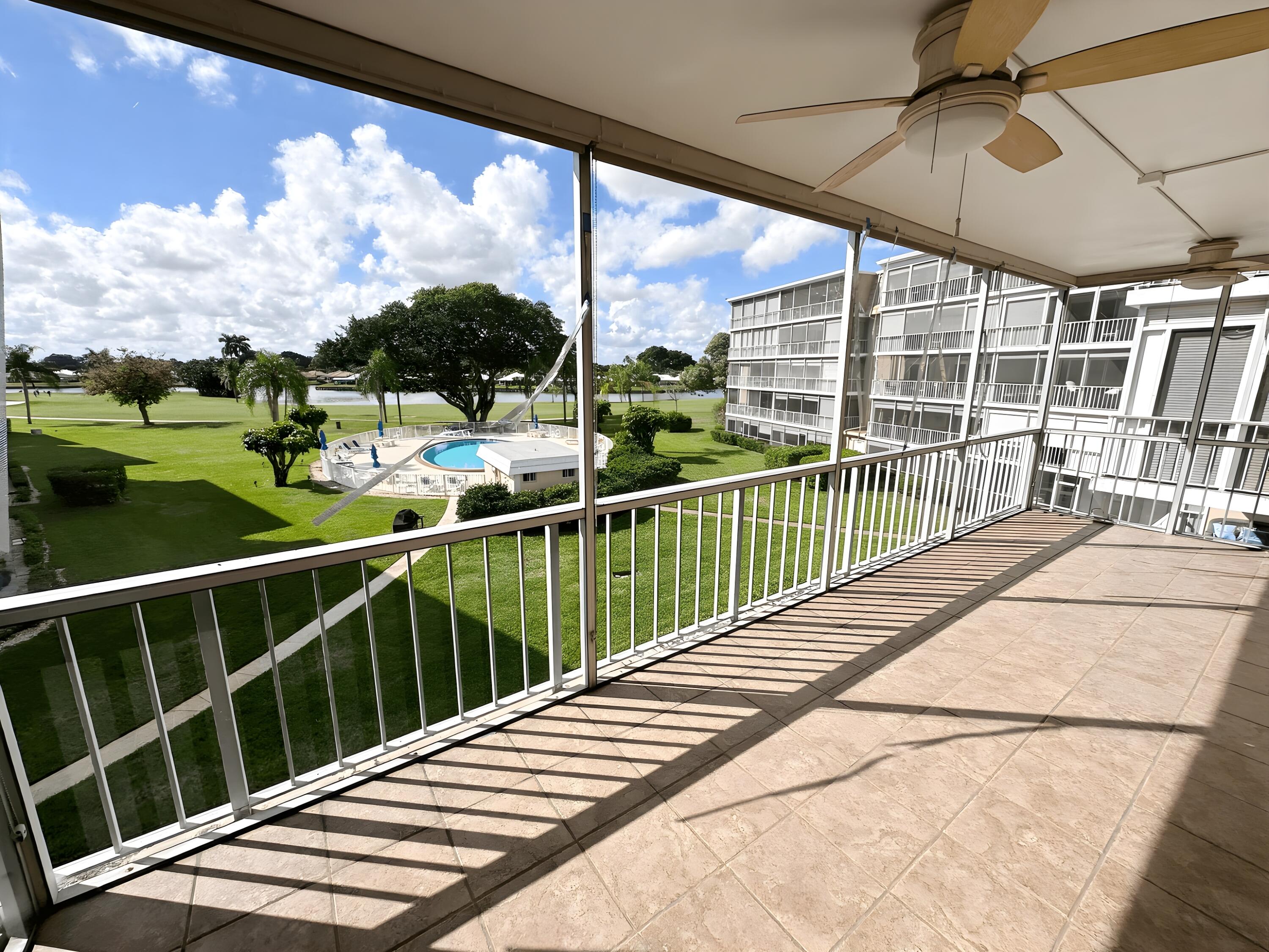 145 Atlantis Boulevard, Unit 302 Atlantis, FL 33462 - Photo 8 of 19 a view of a balcony with yard