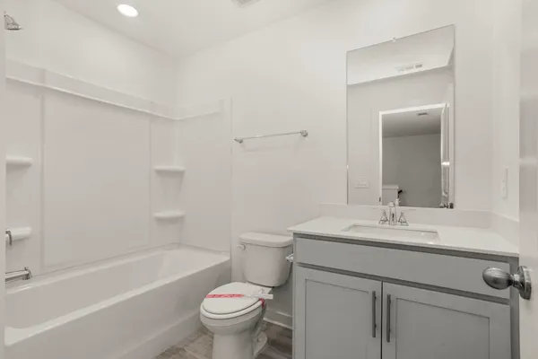a bathroom with a sink toilet and bathtub