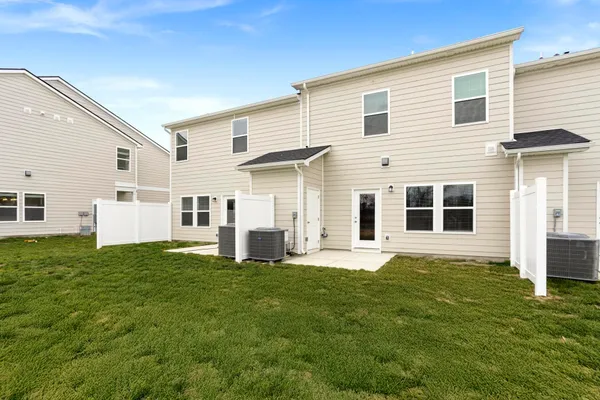 a large white house with a yard