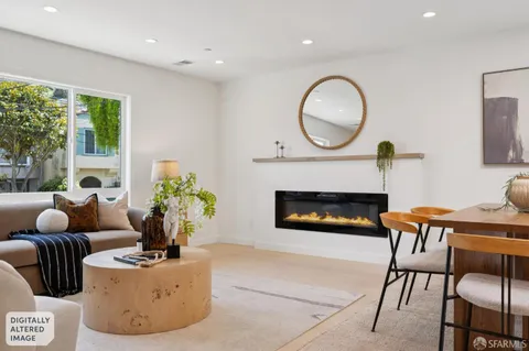 a living room with furniture fireplace and a fireplace