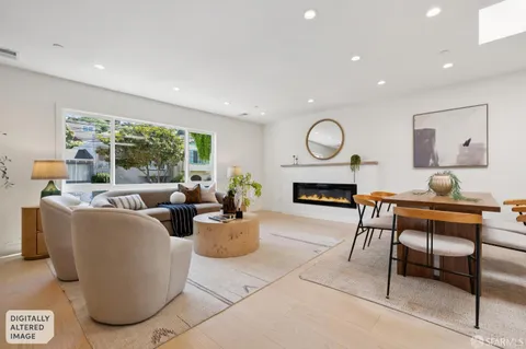 a living room with furniture a rug and a fireplace