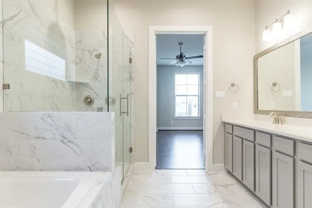 a bathroom with a double vanity sink and a mirror