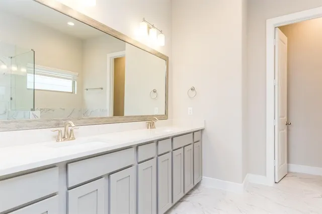 a bathroom with a bathtub and shower