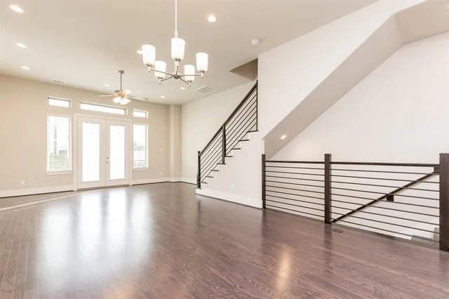 a view of an entryway with wooden floor