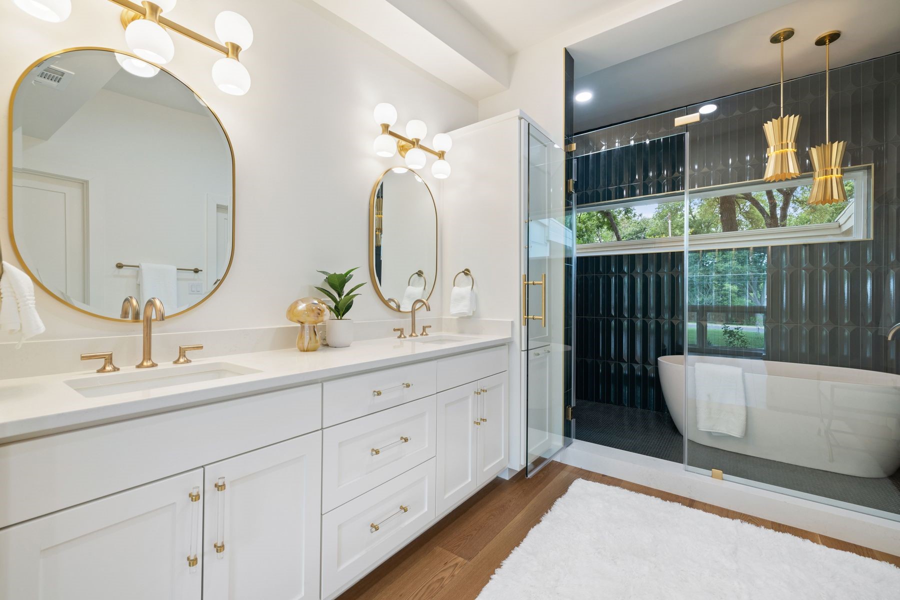 1503 East 15th Street Georgetown, TX 78626 - Photo 13 of 40 a bathroom with a double vanity sink and a mirror