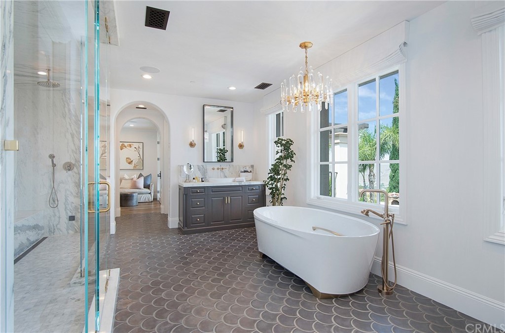 7 Rickie Lane Ladera Ranch, CA 92694 - Photo 21 of 36 a spacious bathroom with a bathtub and sink