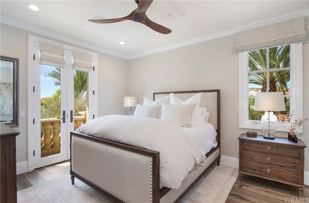 7 Rickie Lane Ladera Ranch, CA 92694 - Photo 25 of 36 a large bed sitting in a bedroom next to a window