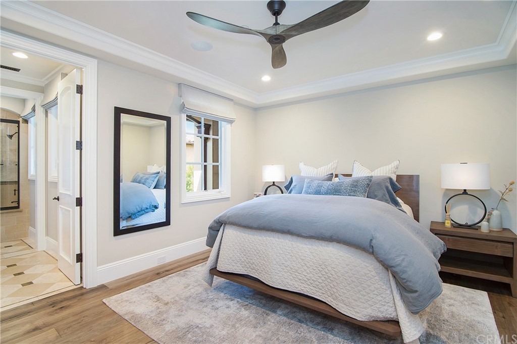 7 Rickie Lane Ladera Ranch, CA 92694 - Photo 27 of 36 a spacious bedroom with a bed and a window