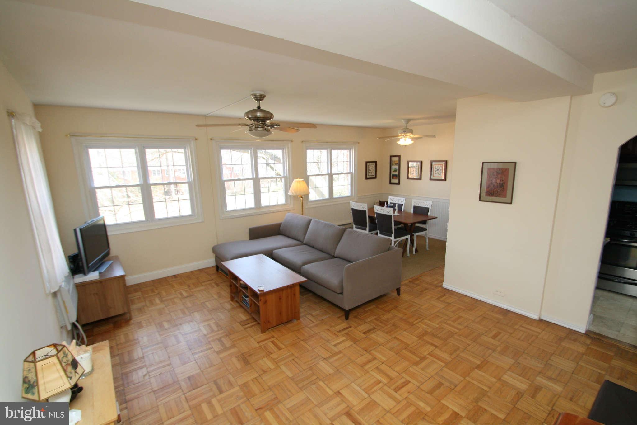 1634 Preston Road Alexandria, VA 22302 - Photo 4 of 19 a living room with furniture and a flat screen tv