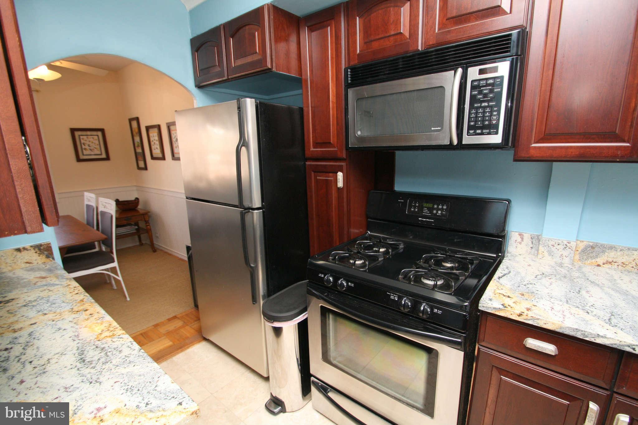1634 Preston Road Alexandria, VA 22302 - Photo 6 of 19 a kitchen with granite countertop stainless steel appliances and wooden cabinets