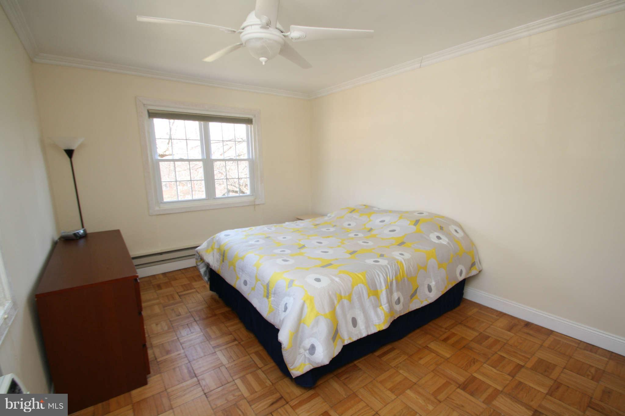 1634 Preston Road Alexandria, VA 22302 - Photo 10 of 19 a bed sitting in a bedroom next to a window