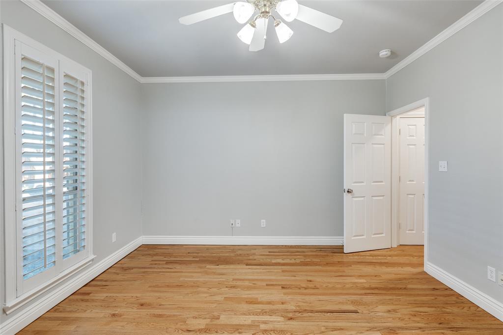 847 Turquoise Point Rockwall, TX 75032 - Photo 18 of 34 a view of an empty room with window and wooden floor