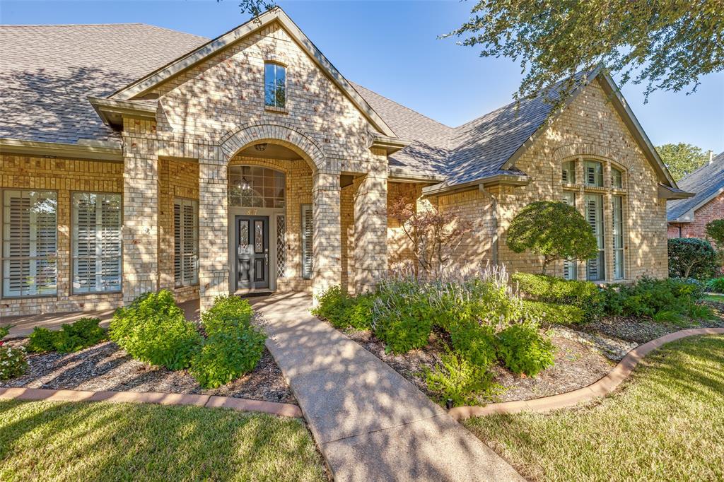 847 Turquoise Point Rockwall, TX 75032 - Photo 2 of 34 a front view of a house with garden