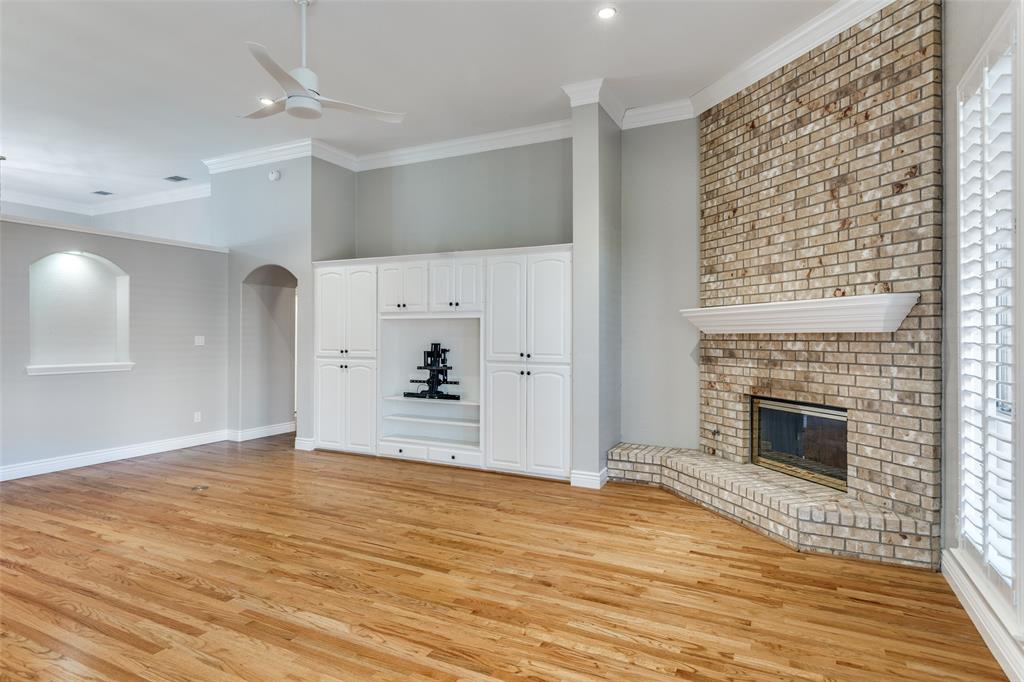 847 Turquoise Point Rockwall, TX 75032 - Photo 5 of 34 a view of empty room with wooden floor and fireplace