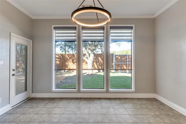 a bathroom with a large window and a sink
