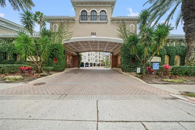 a front view of a building with tree s