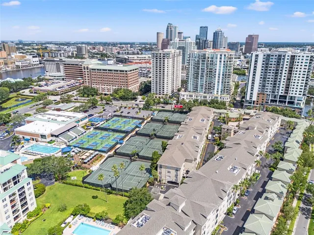 a view of washer and dryer with kitchen in the background