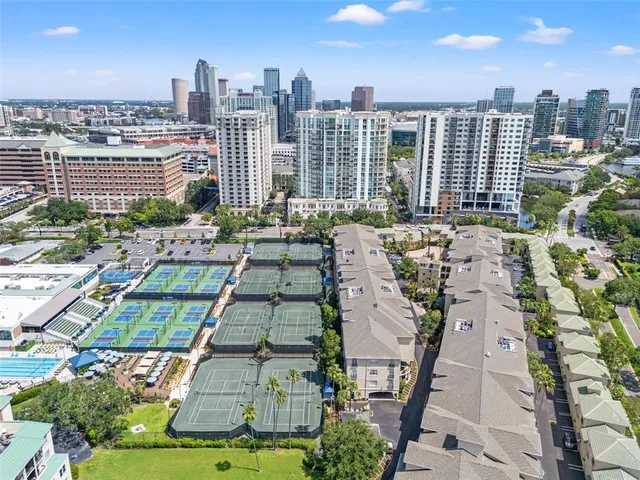 an aerial view of a city with ocean view